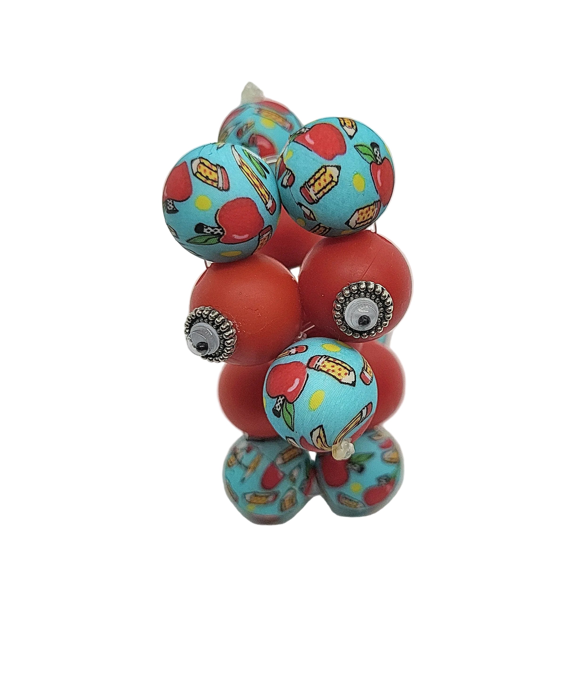Colorful beaded balloon dog with red and blue beads on a white background